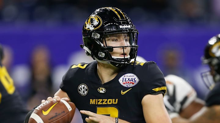 HOUSTON, TX – DECEMBER 27: Drew Lock #3 of the Missouri Tigers looks for a receiver against the Texas Longhorns during the Academy Sports & Outdoors Bowl at NRG Stadium on December 27, 2017 in Houston, Texas. (Photo by Bob Levey/Getty Images)