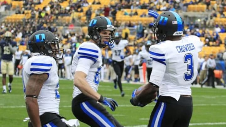 Nov 1, 2014; Pittsburgh, PA, USA; Duke Blue Devils running back Shaquille Powell (left) and wide receiver Max McCaffrey (middle) celebrate with wide receiver Jamison Crowder (3) after Crowder scored a touchdown against the Pittsburgh Panthers at Heinz Field. Mandatory Credit: Charles LeClaire-USA TODAY Sports