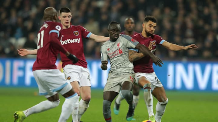 LONDON, ENGLAND - FEBRUARY 04: Sadio Mane of Liverpool battles for possession with Declan Rice, Angelo Ogbonna and Ryan Fredericks of West Ham United during the Premier League match between West Ham United and Liverpool FC at London Stadium on February 04, 2019 in London, United Kingdom. (Photo by Richard Heathcote/Getty Images)