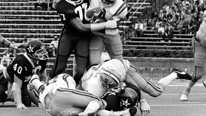 Vanderbilt defensive end Dennis Harrison (77) grabbed LSU tailback Charles Alexander (4) to make the stop. The Commodores lost 28-15 in Nashville Oct. 8, 1977.Title Sec Classic Vandy Vs Lsu
