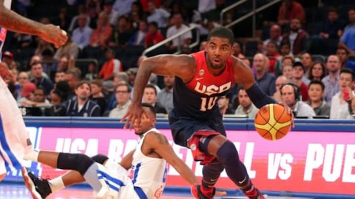 Aug 22, 2014; New York, NY, USA; United States guard Kyrie Irving (10) controls the ball in front of Puerto Rico forward Alexander Franklin (6) during the first quarter of a game at Madison Square Garden. Mandatory Credit: Brad Penner-USA TODAY Sports