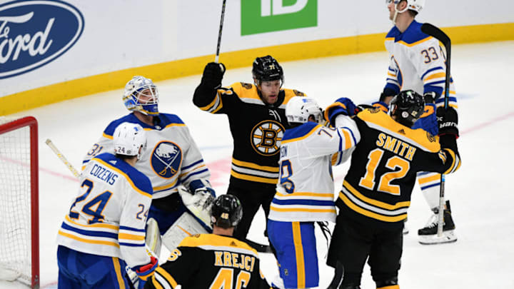Apr 13, 2021; Boston, Massachusetts, USA; Boston Bruins right wing Craig Smith (12) celebrates with left wing Taylor Hall (71) after scoring against the Buffalo Sabres during the second period at TD Garden. Mandatory Credit: Brian Fluharty-USA TODAY Sports