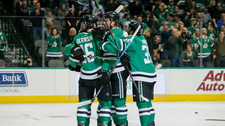 DALLAS, TX - DECEMBER 03: Dallas Stars center Jason Dickinson (16) celebrates with his teammates after scoring a goal with a broken stick during the game between the Dallas Stars and the Edmonton Oilers on December 3, 2018 at the American Airlines Center in Dallas, Texas. (Photo by Matthew Pearce/Icon Sportswire via Getty Images)