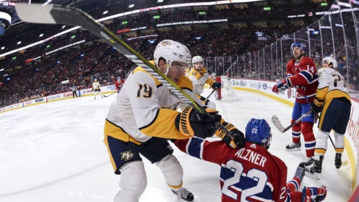 MONTREAL, QC - FEBRUARY 10: Calle Jarnkrok #19 of the Nashville Predators takes down Karl Alzner #22 of the Montreal Canadiens during the NHL game at the Bell Centre on February 10, 2018 in Montreal, Quebec, Canada. The Nashville Predators defeated the Montreal Canadiens 3-2 in a shootout. (Photo by Minas Panagiotakis/Getty Images)