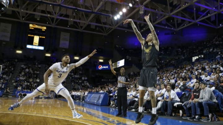 BUFFALO, NY - FEBRUARY 29: Jayvon Graves #3 of the Buffalo Bulls watches as Channel Banks #11 of the Akron Zips takes a shot during the second half at Alumni Arena on February 29, 2020 in Buffalo, New York. Akron beats Buffalo 86 to 73. (Photo by Timothy T Ludwig/Getty Images)