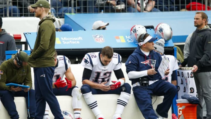 NASHVILLE, TN - NOVEMBER 11: Tom Brady #12 of the New England Patriots rests on the sideline during the fourth quarter against the Tennessee Titans at Nissan Stadium on November 11, 2018 in Nashville, Tennessee. (Photo by Frederick Breedon/Getty Images)