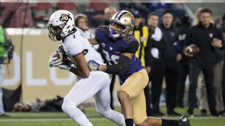 December 2, 2016; Santa Clara, CA, USA; Colorado Buffaloes wide receiver Shay Fields (1) is tackled by Washington Huskies defensive back Sidney Jones (26) during the first quarter in the Pac-12 championship at Levi's Stadium. Mandatory Credit: Kyle Terada-USA TODAY Sports