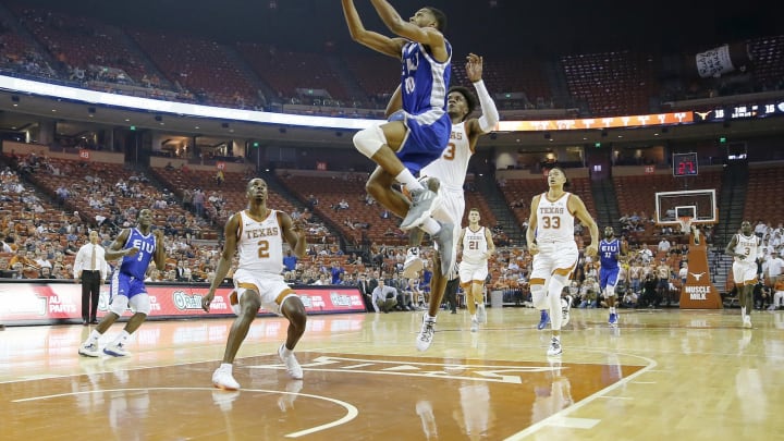 Cam Burrell #10 then of the Eastern Illinois Panthers leaps to the basket between(Photo by Chris Covatta/Getty Images)