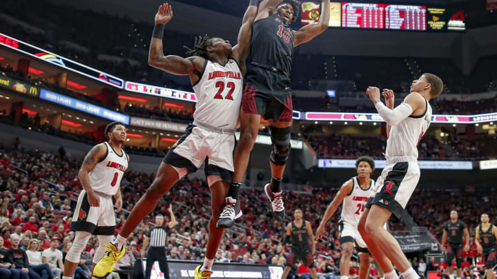 LOUISVILLE, KY – NOVEMBER 17: Aidan Igiehon #22 of the Louisville Cardinals battles for a rebound against Evan Clayborne #10 of the North Carolina Central Eagles at KFC YUM! Center on November 17, 2019 in Louisville, Kentucky. (Photo by Michael Hickey/Getty Images)