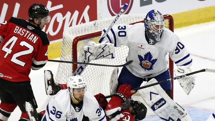 TORONTO, ON - NOVEMBER 17: Nathan Bastian #42 and Brandon Baddock #13 of the Binghamton Devils battle with Josh Jooris #36 and Kasimir Kaskisuo #30 of the Toronto Marlies during AHL game action on November 17, 2018 at Coca-Cola Coliseum in Toronto, Ontario, Canada. (Photo by Graig Abel/Getty Images)