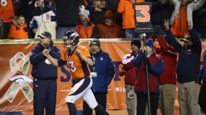 DENVER, CO - NOVEMBER 27: Quarterback Trevor Siemian #13 of the Denver Broncos celebrates throwing a touchdown in the third quarter of the game against the Kansas City Chiefs at Sports Authority Field at Mile High on November 27, 2016 in Denver, Colorado. (Photo by Ezra Shaw/Getty Images)
