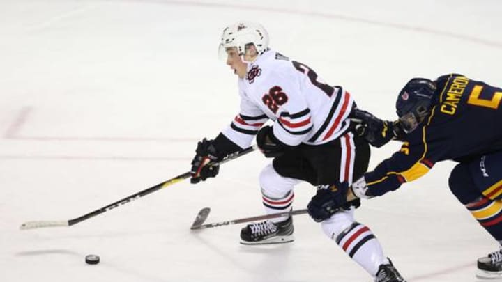 ST CATHARINES, ON – OCTOBER 11: Christopher Cameron #5 of the Barrie Colts struggles to contain Philip Tomasino #26 of the Niagara IceDogs during the first period of an OHL game at Meridian Centre on October 11, 2018 in St Catharines, Canada. (Photo by Vaughn Ridley/Getty Images)