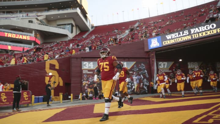 LOS ANGELES, CALIFORNIA - OCTOBER 19: Guard Alijah Vera-Tucker #75 USC Trojans run onto the field for the game against the Arizona Wildcats at Los Angeles Memorial Coliseum on October 19, 2019 in Los Angeles, California. (Photo by Meg Oliphant/Getty Images)
