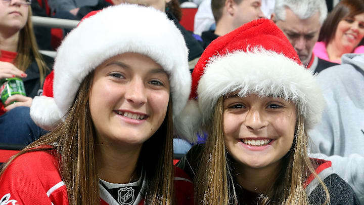 RALEIGH, NC – DECEMBER 18: Carolina Hurricanes fans display their holiday spirit as they wait for puck drop prior to an NHL game against the Toronto Maple Leafs at PNC Arena on December 18, 2014 in Raleigh, North Carolina. (Photo by Gregg Forwerck/NHLI via Getty Images)