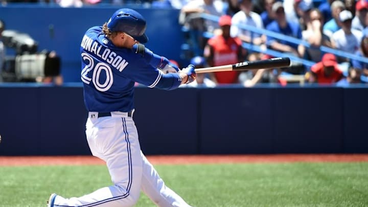 Jun 14, 2016; Toronto, Ontario, CAN; Toronto Blue Jays third baseman Josh Donaldson (20) hits a grand slam home run against Philadelphia Phillies in the third inningat Rogers Centre. Mandatory Credit: Dan Hamilton-USA TODAY Sports