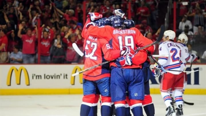 May 10, 2013; Washington, DC, USA; Washington Capitals center Nicklas Backstrom (19) and defenseman Mike Green (52) celebrate with teammates after a goal in the second period against the New York Rangers in game five of the first round of the 2013 Stanley Cup Playoffs at the Verizon Center. Mandatory Credit: Evan Habeeb-USA TODAY Sports