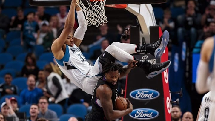 Nov 12, 2016; Minneapolis, MN, USA; Minnesota Timberwolves center Karl-Anthony Towns (32) dunks over Los Angeles Clippers center DeAndre Jordan (6) in the first quarter at Target Center. Mandatory Credit: Brad Rempel-USA TODAY Sports