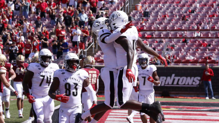 LOUISVILLE, KENTUCKY – OCTOBER 05: Hassan Hall #19 and Tutu Atwell #1 of the Louisville Cardinals celebrate after a touchdown at Cardinal Stadium on October 05, 2019 in Louisville, Kentucky. (Photo by Justin Casterline/Getty Images)