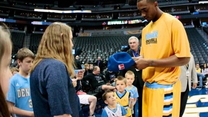 Apr 12, 2014; Denver, CO, USA; Denver Nuggets power forward Darrell Arthur (00) signs autographs for fans prior to the game against the Utah Jazz at the Pepsi Center. Mandatory Credit: Isaiah J. Downing-USA TODAY Sports