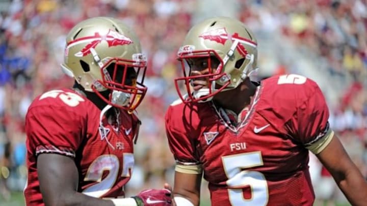 Apr 12, 2014; Tallahassee, FL, USA; Florida State Seminoles quarterback Jameis Winston (5) congratulates fullback Freddie Stevenson (23) after a touchdown during the spring game at Doak Campbell Stadium. Mandatory Credit: Melina Vastola-USA TODAY Sports