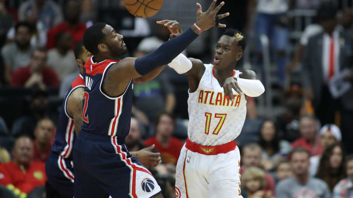 Apr 28, 2017; Atlanta, GA, USA; Atlanta Hawks guard Dennis Schroder (17) passes out of the defense of Washington Wizards guard John Wall (2) in the first quarter in game six of the first round of the 2017 NBA Playoffs at Philips Arena. Mandatory Credit: Jason Getz-USA TODAY Sports