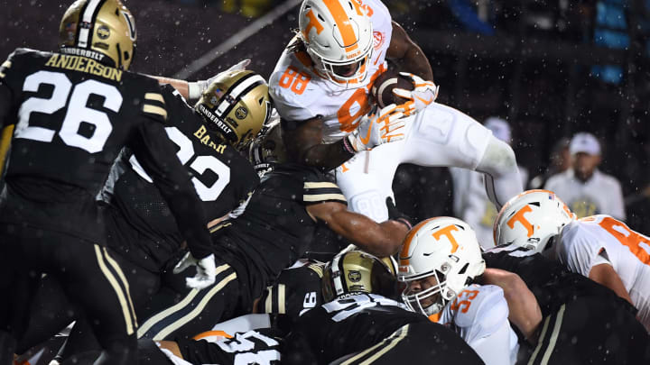 Nov 26, 2022; Nashville, Tennessee, USA; Tennessee Volunteers tight end Princeton Fant (88) is pushed across the goal line on a touchdown during the first half against the Vanderbilt Commodores at FirstBank Stadium. Mandatory Credit: Christopher Hanewinckel-USA TODAY Sports