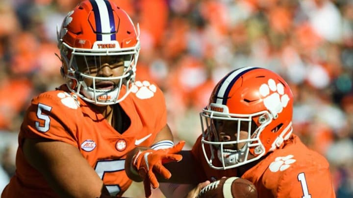 Nov 20, 2021; Clemson, South Carolina, USA; Clemson quarterback D.J. Uiagalelei (5) hands the ball to running back Will Shipley (1) during their game against Wake Forest at Memorial Stadium. Mandatory Credit: Josh Morgan-USA TODAY Sports