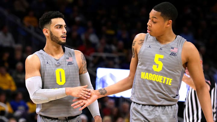 Marquette Golden Eagles guard Markus Howard (0) and Marquette Golden Eagles guard Greg Elliott (5) work together for point during the Marquette vs. North Dakota State men’s basketball game at Fiserv Forum in Milwaukee, December 20, 2019.Mumen21 12bwood