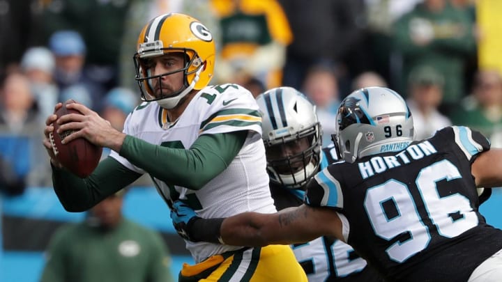 CHARLOTTE, NC – DECEMBER 17: Aaron Rodgers #12 of the Green Bay Packers runs from the Carolina Panthers defense in the third quarter during their game at Bank of America Stadium on December 17, 2017 in Charlotte, North Carolina. (Photo by Streeter Lecka/Getty Images)