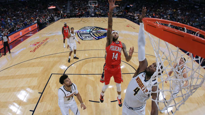 NEW ORLEANS, LOUISIANA – OCTOBER 31: Brandon Ingram #14 of the New Orleans Pelicans shoots against Paul Millsap #4 of the Denver Nuggets during a game at the Smoothie King Center on October 31, 2019 in New Orleans, Louisiana. NOTE TO USER: User expressly acknowledges and agrees that, by downloading and or using this Photograph, user is consenting to the terms and conditions of the Getty Images License Agreement. (Photo by Jonathan Bachman/Getty Images)