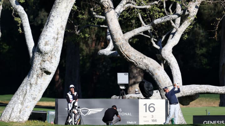 PACIFIC PALISADES, CALIFORNIA - FEBRUARY 16: Rickie Fowler of the United States tees off on the 16th green during a pro-am prior to The Genesis Invitational at Riviera Country Club on February 16, 2022 in Pacific Palisades, California. (Photo by Rob Carr/Getty Images)