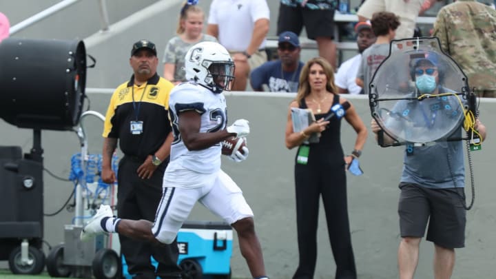 WEST POINT, NY – SEPTEMBER 18: Brian Brewton #28 of the Connecticut Huskies returns a kickoff for a touchdown against the Army Black Knights at Michie Stadium on September 18, 2021, in West Point, New York. (Photo by Edward Diller/Getty Images)