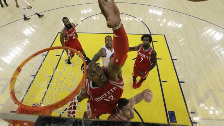 Apr 27, 2016; Oakland, CA, USA; Houston Rockets center Dwight Howard (12) rebounds against the Golden State Warriors during game five of the first round of the NBA Playoffs against the Houston Rockets at Oracle Arena. The Golden State Warriors defeated the Houston Rockets 114-81. Mandatory Credit: Marcio Jose Sanchez/Pool Photo via USA TODAYSports