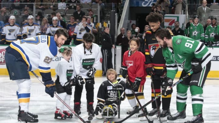 DALLAS, TX - FEBRUARY 16: Local area hockey players from all levels were on hand as part of the Hockey Is For Everyone initiative to drop a ceremonial first puck between Alex Pietrangelo #27 of the St. Louis Blues and Tyler Seguin #91 of the Dallas Stars at the American Airlines Center on February 16, 2018 in Dallas, Texas. (Photo by Glenn James/NHLI via Getty Images)