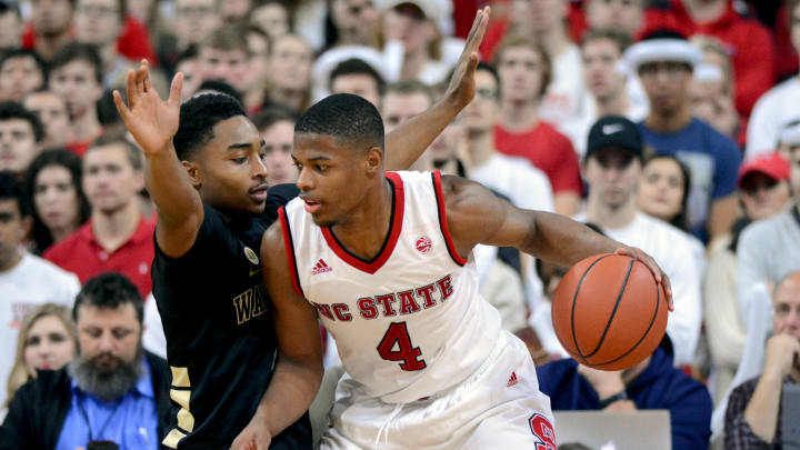 Jan 21, 2017; Raleigh, NC, USA; North Carolina State Wolfpack guard Dennis Smith Jr. (4) drives to the basket as Wake Forest Demon Deacons guard Brandon Childress (0) defends during the second half at PNC Arena. The Demon Deacons won 93-88. Mandatory Credit: Rob Kinnan-USA TODAY Sports