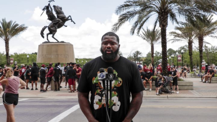 TALLAHASSEE, FL - JUNE 13: Defensive tackle Marvin Wilson #21 of the Florida State Football Team speaks with the media before a unity walk on June 13, 2020 in Tallahassee, Florida. Florida State players and members of the football coaching staff led fans and supporters on a unity walk from the Doak Campbell Stadium on the Florida State University campus to the state capitol building in support of the Black Lives Matter movement. Protests erupted across the nation after George Floyd died in police custody in Minneapolis, Minnesota on May 25th. (Photo by Don Juan Moore/Getty Images)