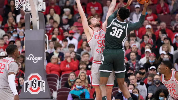 Ohio State Buckeyes center Joey Brunk (50) defends Michigan State Spartans forward Marcus Bingham Jr. (30) during the first half of the NCAA men’s basketball game at Value City Arena in Columbus on March 3, 2022.Michigan State Spartans At Ohio State Buckeyes
