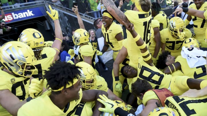 EUGENE, OR - OCTOBER 13: The Oregon Ducks celebrate after running back CJ Verdell #34 of the Oregon Ducks scored the winning touchdown in overtime of the game against the Washington Huskies at Autzen Stadium on October 13, 2018 in Eugene, Oregon. The Ducks won the game 30-27. (Photo by Steve Dykes/Getty Images)