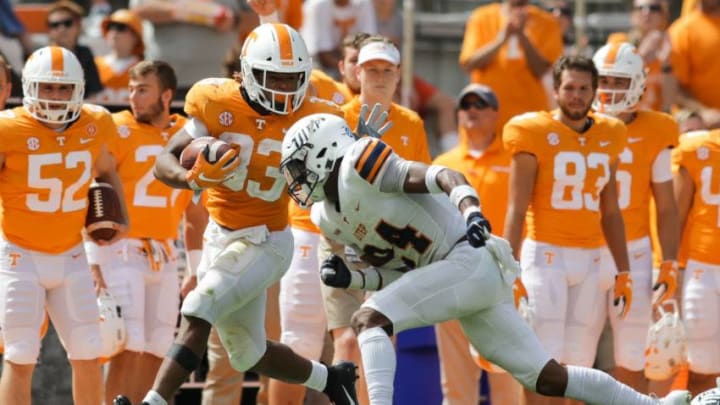 KNOXVILLE, TN - SEPTEMBER 15: Running back Jeremy Banks #33 of the Tennessee Volunteers is tackled by defensive back Kahani Smith #24 of the UTEP Miners during the second half of the game between the UTEP Miners and Tennessee Volunteers at Neyland Stadium on September 15, 2018 in Knoxville, Tennessee. Tennessee won the game 24-0. (Photo by Donald Page/Getty Images)