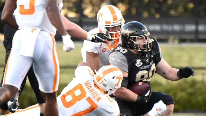 Vanderbilt defensive lineman Cameron Tidd (90) returns a fumble by Tennessee quarterback Harrison Bailey (15) during the first quarter at Vanderbilt Stadium Saturday, Dec. 12, 2020 in Nashville, Tenn.Gw42957