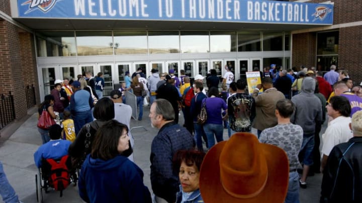 UNITED STATES - MARCH 24: Fans wait to enter the Ford Center for a National Basketball Association (NBA) game between the Los Angeles Lakers and the Oklahoma City Thunder in Oklahoma City, Oklahoma, U.S., on Tuesday, March 24, 2009. Nearly three decades after an energy bust that forced 122 banks to close statewide, Oklahoma City is in the fifth year of an economic expansion that's produce the lowest jobless rate for a major metro U.S. area. Oklahoma City demonstrated it could support a NBA team, encouraging the Seattle Supersonics to move permanently and become the Thunder, which now draw crowds as large as the Boston Celtics. (Photo by J.P. Wilson/Bloomberg via Getty Images)