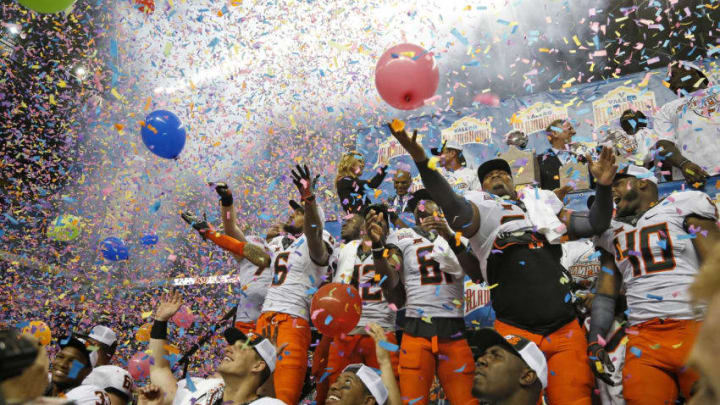 SAN ANTONIO,TX – DECEMBER 29: Oklahoma State Cowboys celebrate their victory over the Colorado Buffaloes in the Valero Alamo Bowl at the Alamodome on December 29, 2016 in San Antonio, Texas. (Photo by Ronald Cortes/Getty Images)