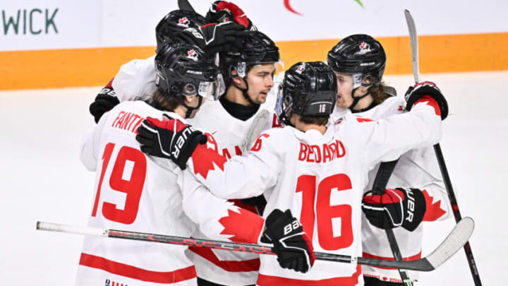 HALIFAX, CANADA - JANUARY 05: Dylan Guenther #11 of Team Canada celebrates his goal with teammates Adam Fantilli #19, Connor Bedard #16 and Brennan Othmann #7 during the first period against Team Czech Republic in the gold medal round of the 2023 IIHF World Junior Championship at Scotiabank Centre on January 5, 2023 in Halifax, Nova Scotia, Canada. (Photo by Minas Panagiotakis/Getty Images)