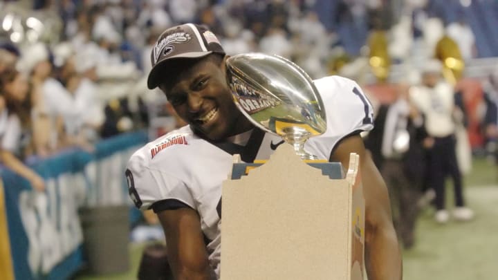 Dec 29 2007; San Antonio, TX, USA; Penn State Nittany Lions wide receiver Chris Bell (19) carries the trophy after defeating the Texas A&M Aggies in the Alamo Bowl at the Alamodome. Penn State beat Texas A&M 24-17. Mandatory Credit: Brendan Maloney-USA TODAY Sports