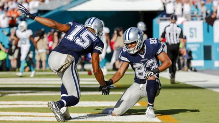 Nov 22, 2015; Miami Gardens, FL, USA; Dallas Cowboys wide receiver Terrance Williams (left) and wide receiver Devin Street (right) both celebrate after wide receiver Dez Bryant (not pictured) scored a touchdown agent the Miami Dolphins during the second half at Sun Life Stadium. The Cowboys won 24-14. Mandatory Credit: Steve Mitchell-USA TODAY Sports