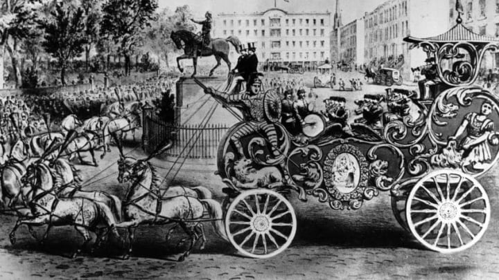 1860: The 'band wagon' of Van Amburgh's circus parade, the 'Great Golden Chariot' passes Union Square, New York. The chariot was the central attraction of the circus parade; it weighed 6000 pounds and cost $7,000, an unheard of sum in those days. (Photo by Three Lions/Getty Images)