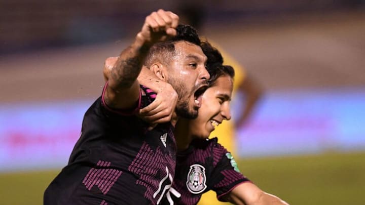 Jesus Corona and Diego Lainez celebrate after El Tri overcame a 1-0 deficit and an uninspired performance to defeat Jamaica. (Photo by RICARDO MAKYN/AFP via Getty Images)