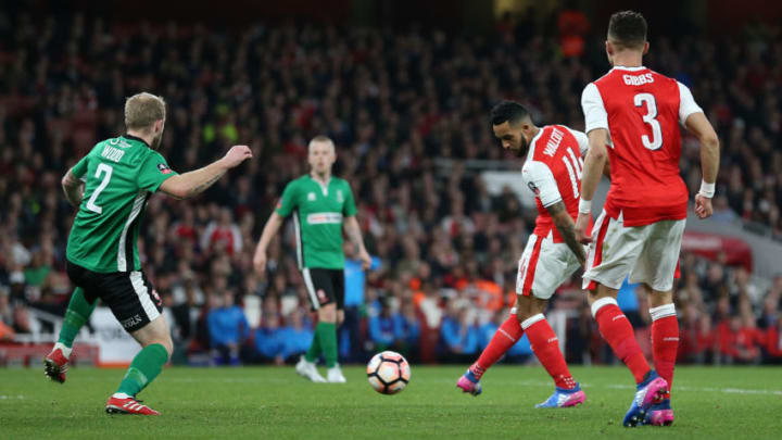 March 11th 2017, London, England; FA Cup 6th round football, Arsenal FC versus Lincoln City; Theo Walcott of Arsenal shoots passed Bradley Wood of Lincoln City to score his sides 1st goal in extra time of the 1st half (Photo by John Patrick Fletcher/Action Plus via Getty Images)