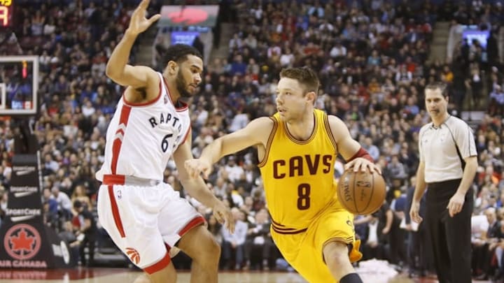 Feb 26, 2016; Toronto, Ontario, CAN; Cleveland Cavaliers guard Matthew Dellavedova (8) dribbles the ball asToronto Raptors guard Cory Joseph (6) defends during the first half at the Air Canada Centre. Mandatory Credit: John E. Sokolowski-USA TODAY Sports