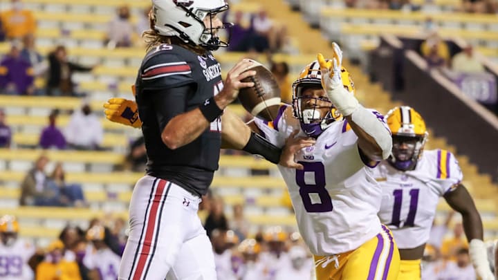 Oct 24, 2020; Baton Rouge, Louisiana, USA; LSU Tigers linebacker BJ Ojulari (8) sacks South Carolina Gamecocks quarterback Collin Hill (15) during the first half at Tiger Stadium. Mandatory Credit: Derick E. Hingle-USA TODAY Sports